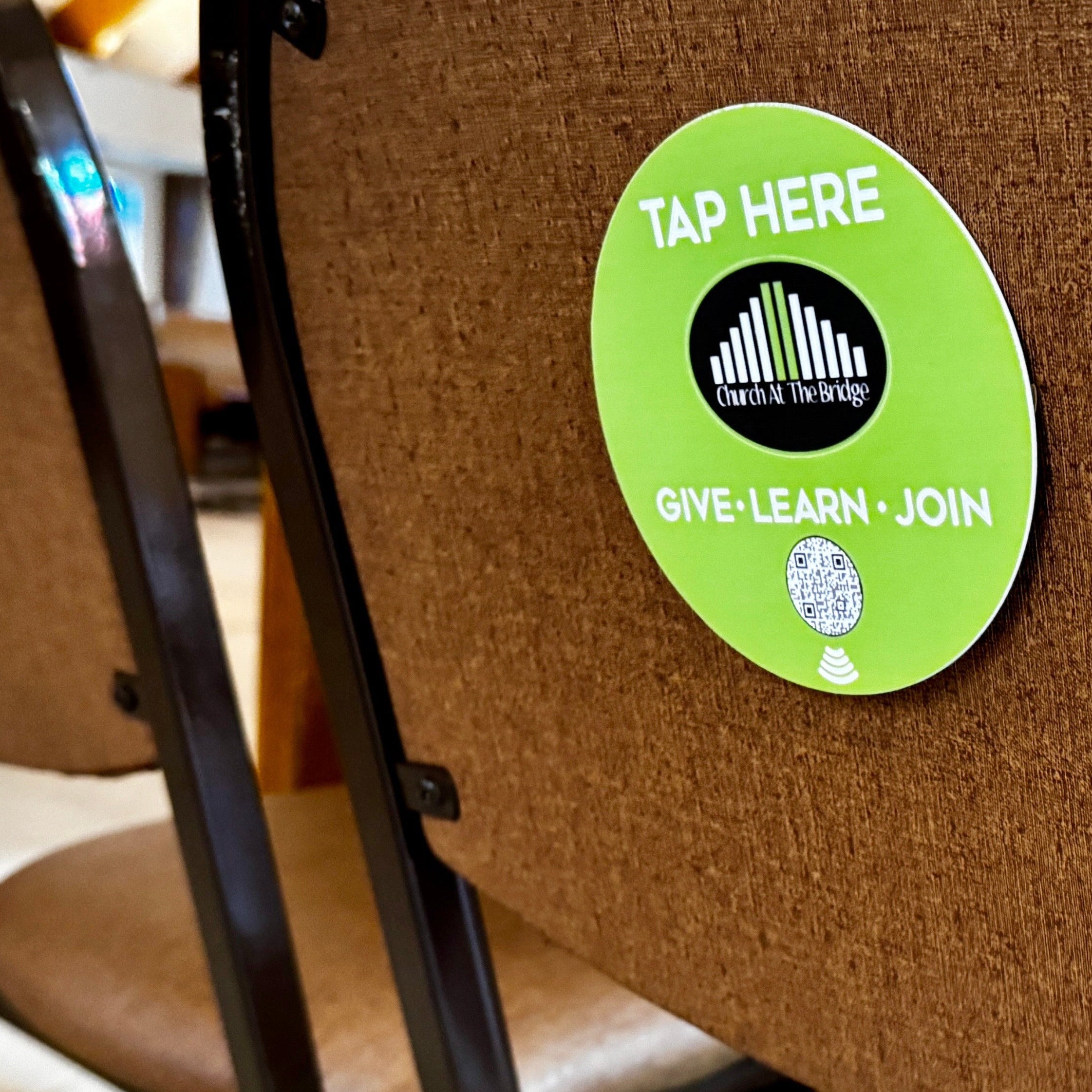 tap to scan qr sign on church chair