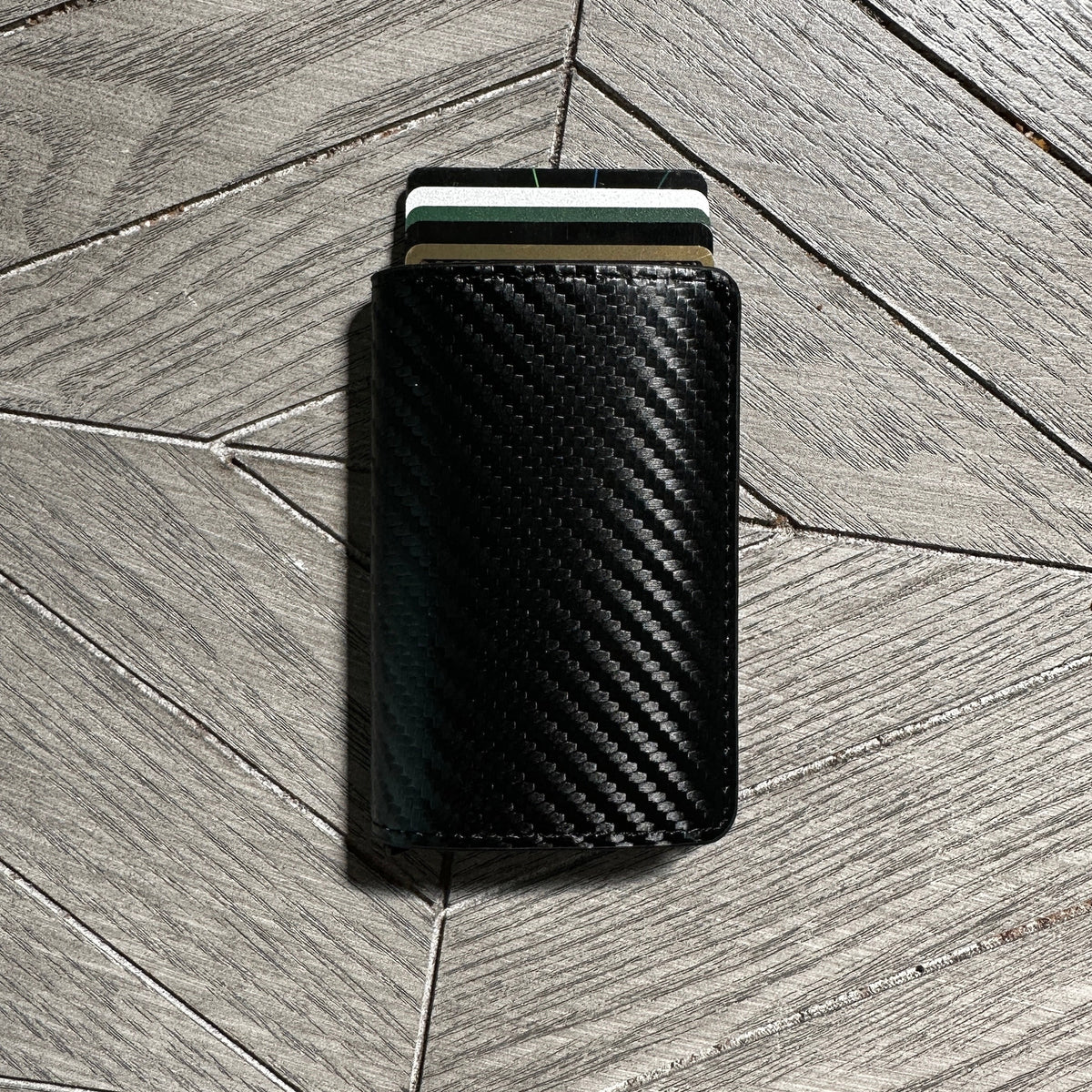 RFID blocking slim pop wallet that holds cards and a Tap NFC business card