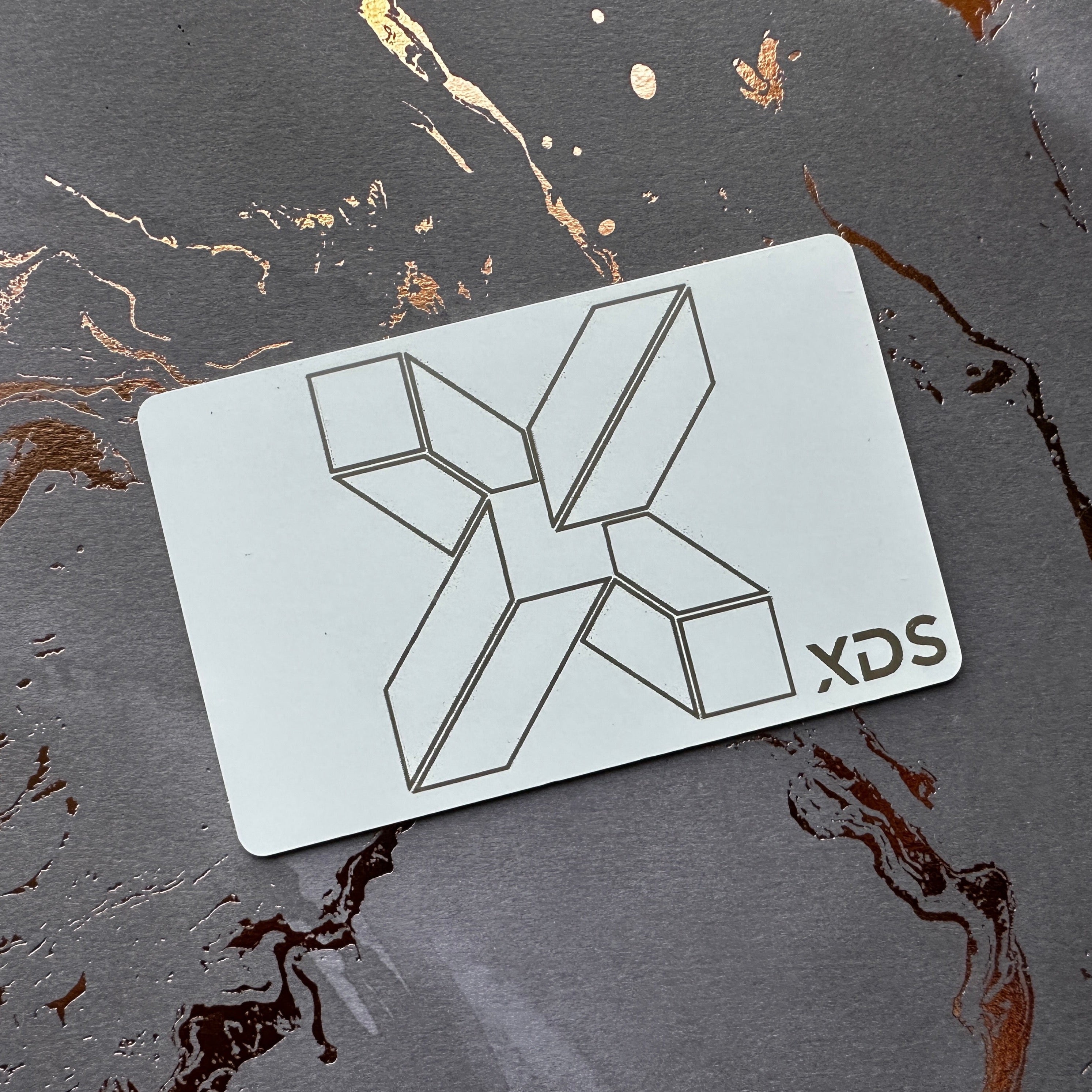 Custom White Tap Metal Business Card. Engraved silver on white. Tap to share contact information and digital profile