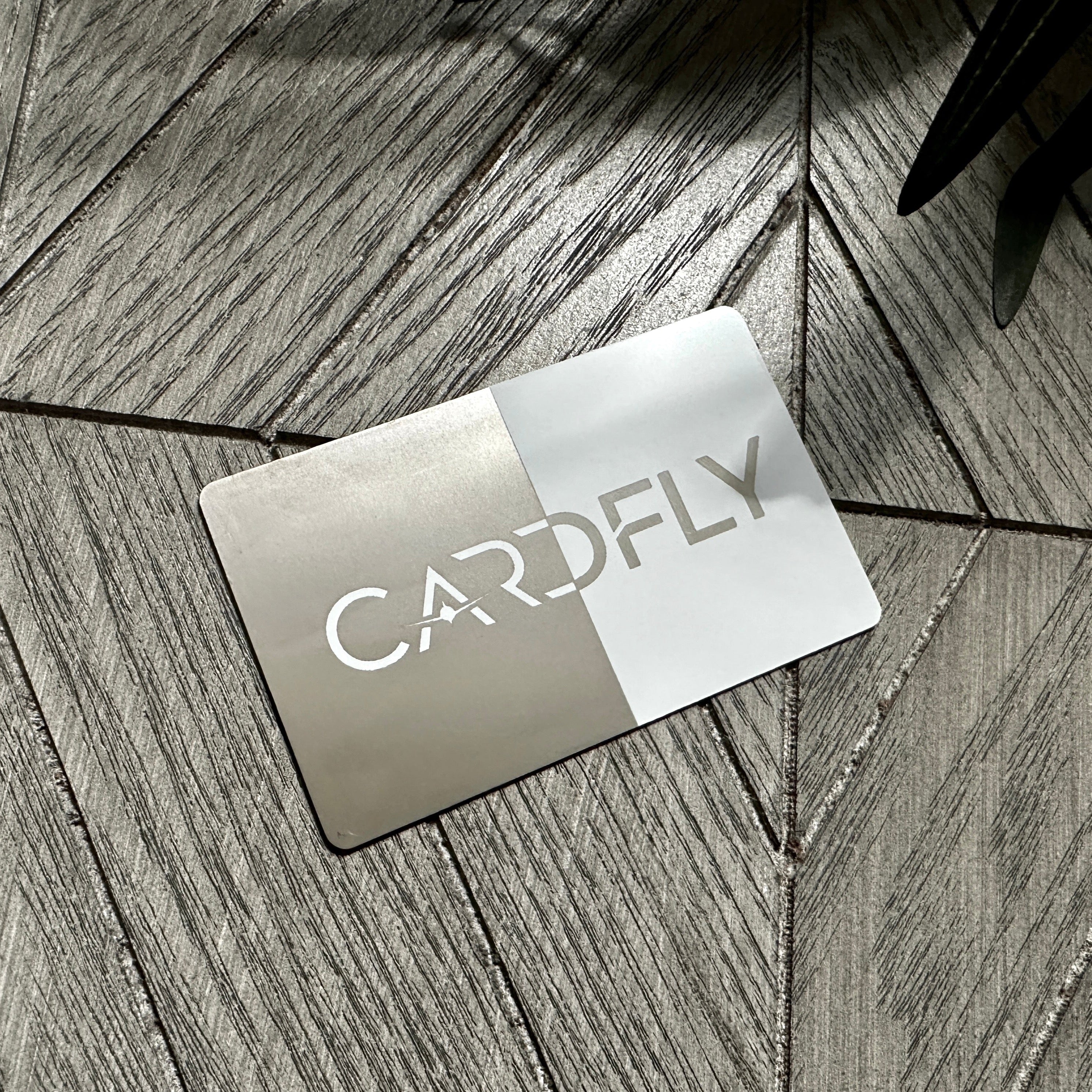 Custom White Tap Metal Business Card. Engraved silver on white. Tap to share contact information and digital profile