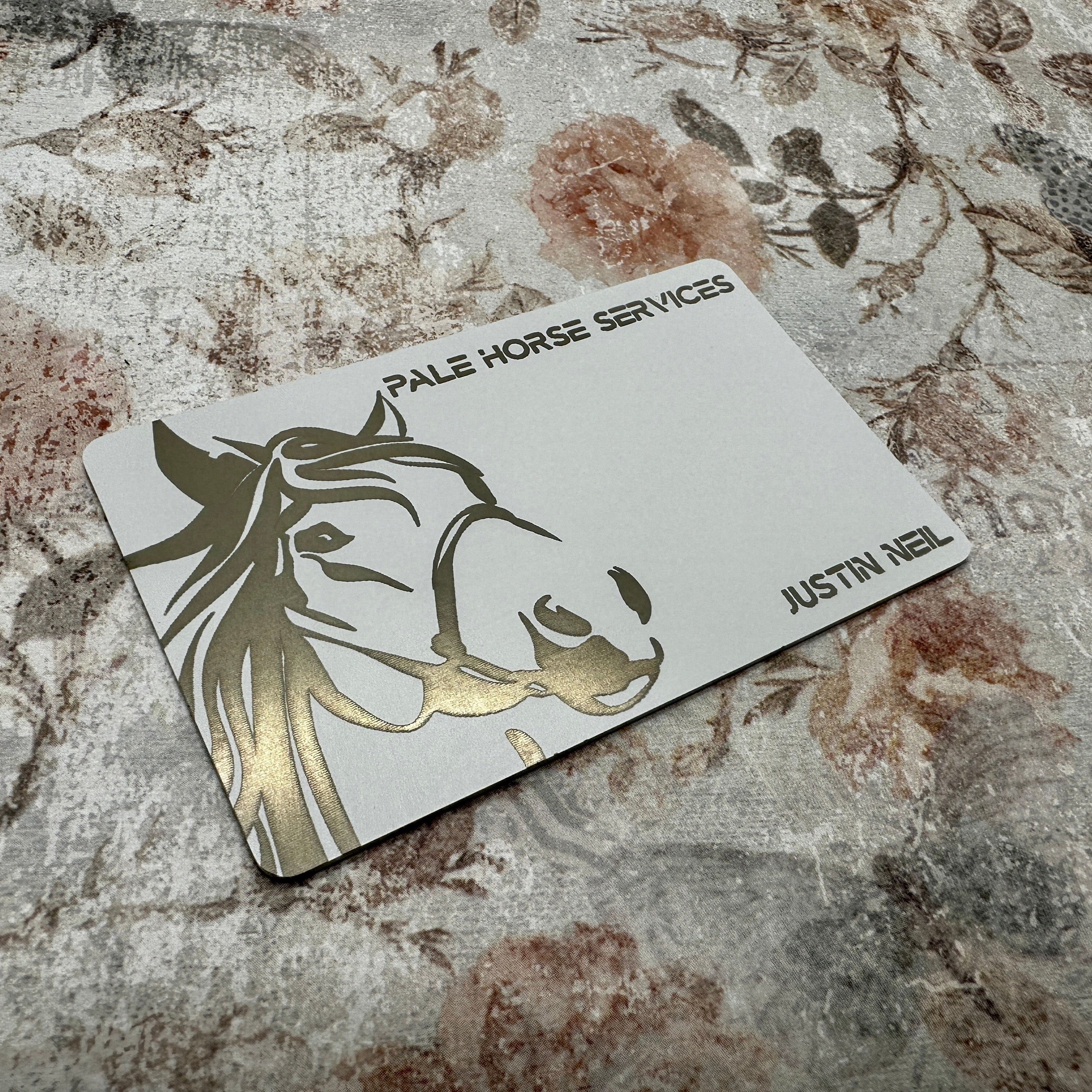 Custom White Tap Metal Business Card. Engraved silver on white. Tap to share contact information and digital profile