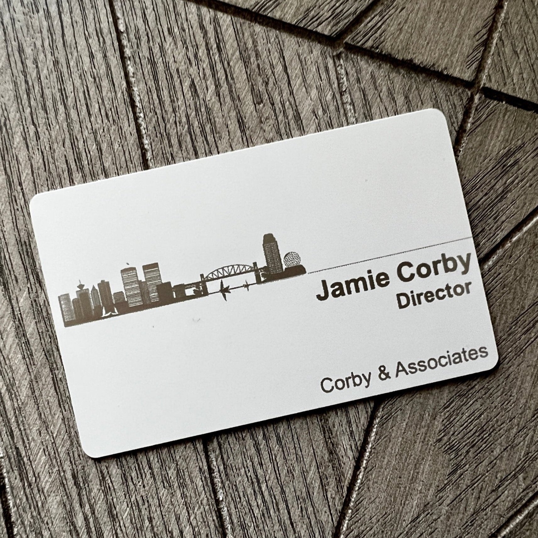 Custom White Tap Metal Business Card. Engraved silver on white. Tap to share contact information and digital profile