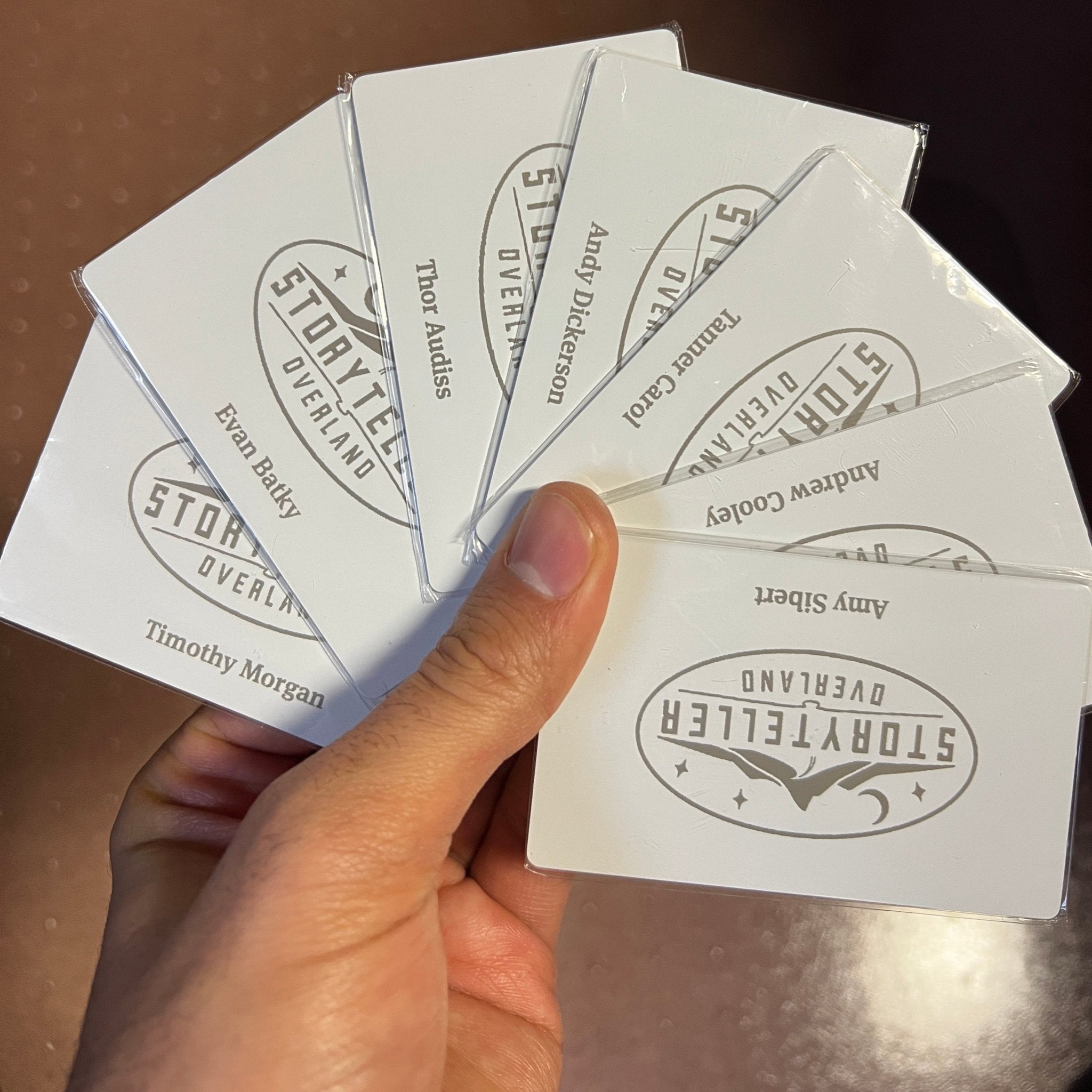 Custom White Tap Metal Business Card. Engraved silver on white. Tap to share contact information and digital profile