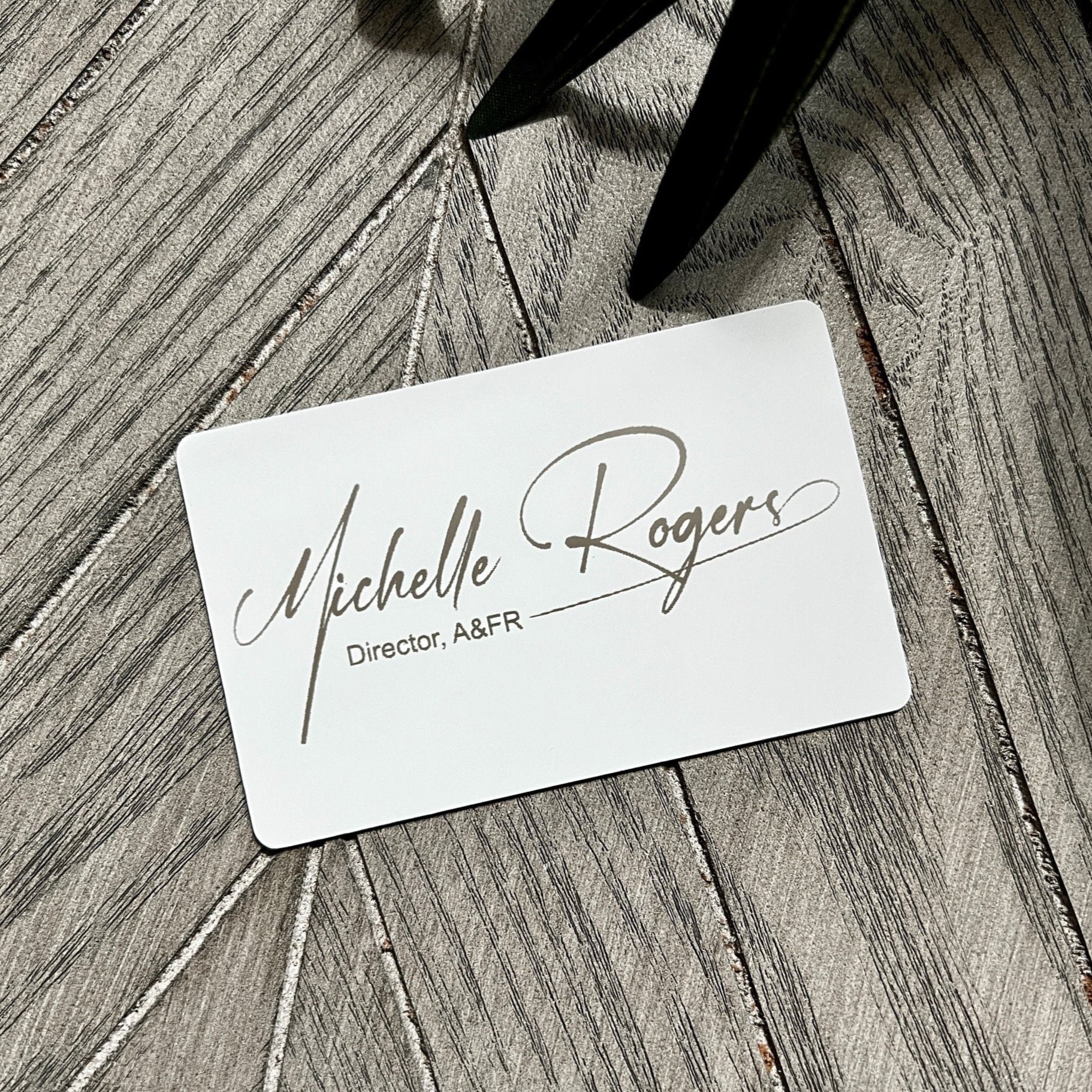 Custom White Tap Metal Business Card. Engraved silver on white. Tap to share contact information and digital profile