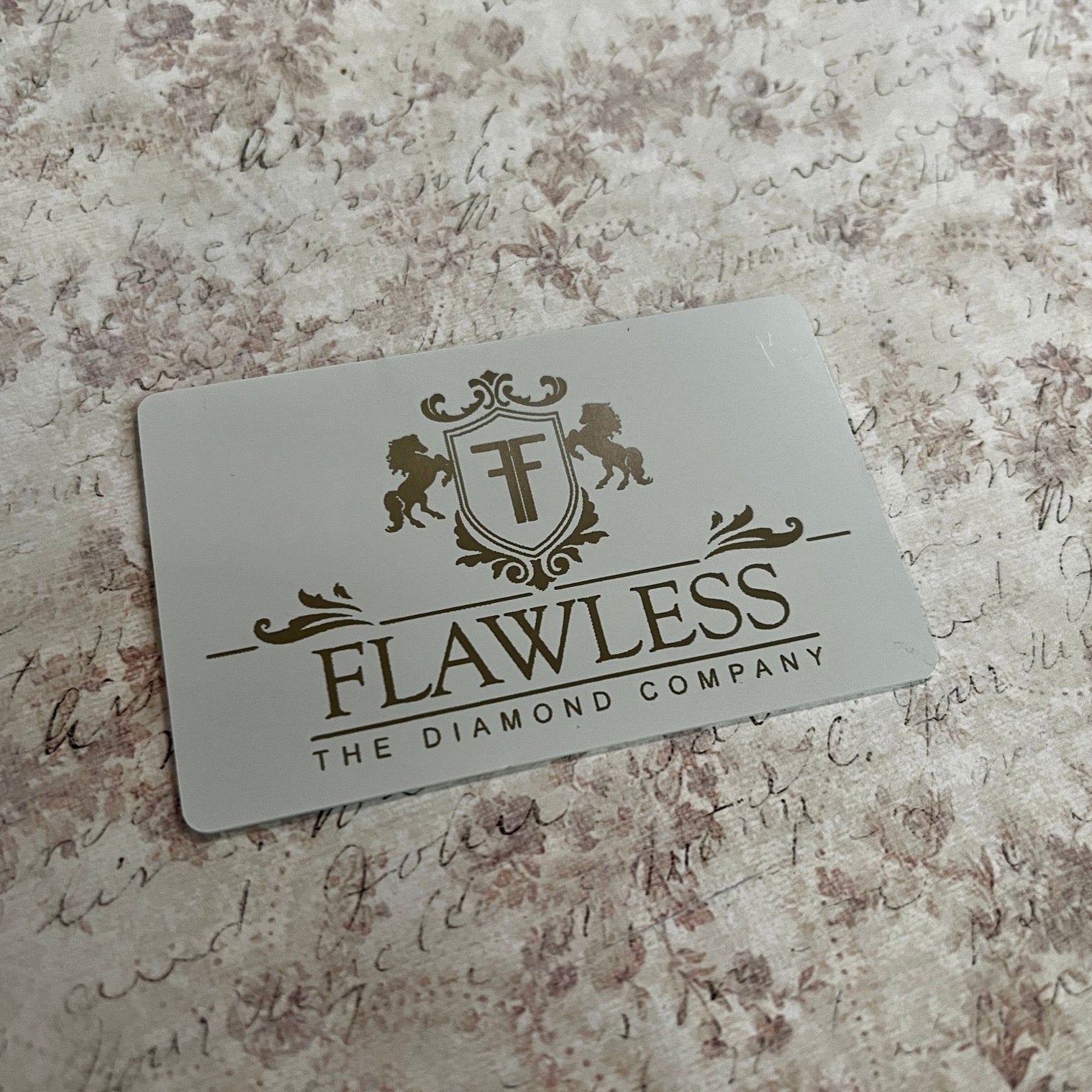 Custom White Tap Metal Business Card. Engraved silver on white. Tap to share contact information and digital profile