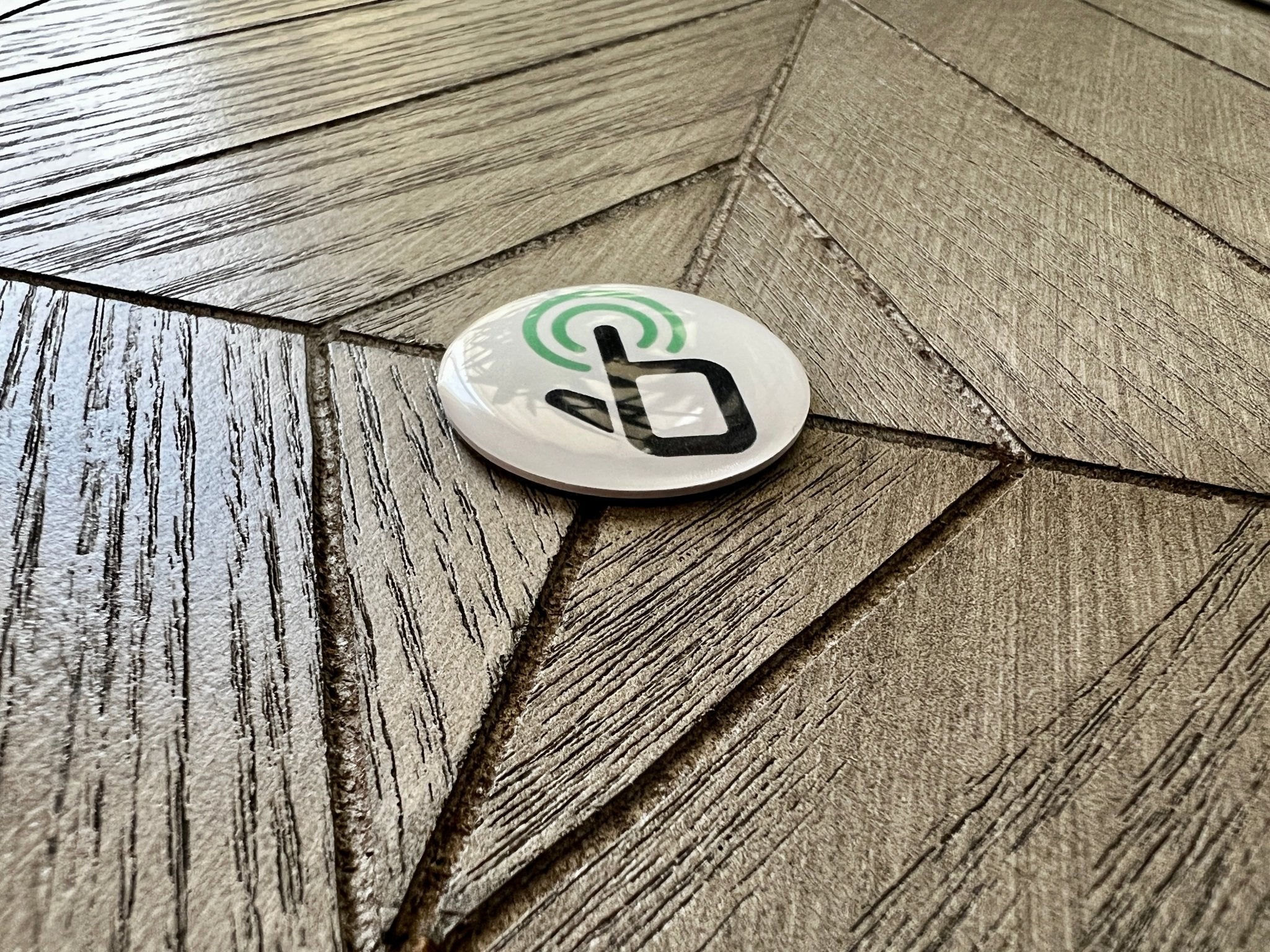 custom sticky dot nfc tap tag, tap tag sticks to back of bottom of phone. Tap to share contract info and digital profile
