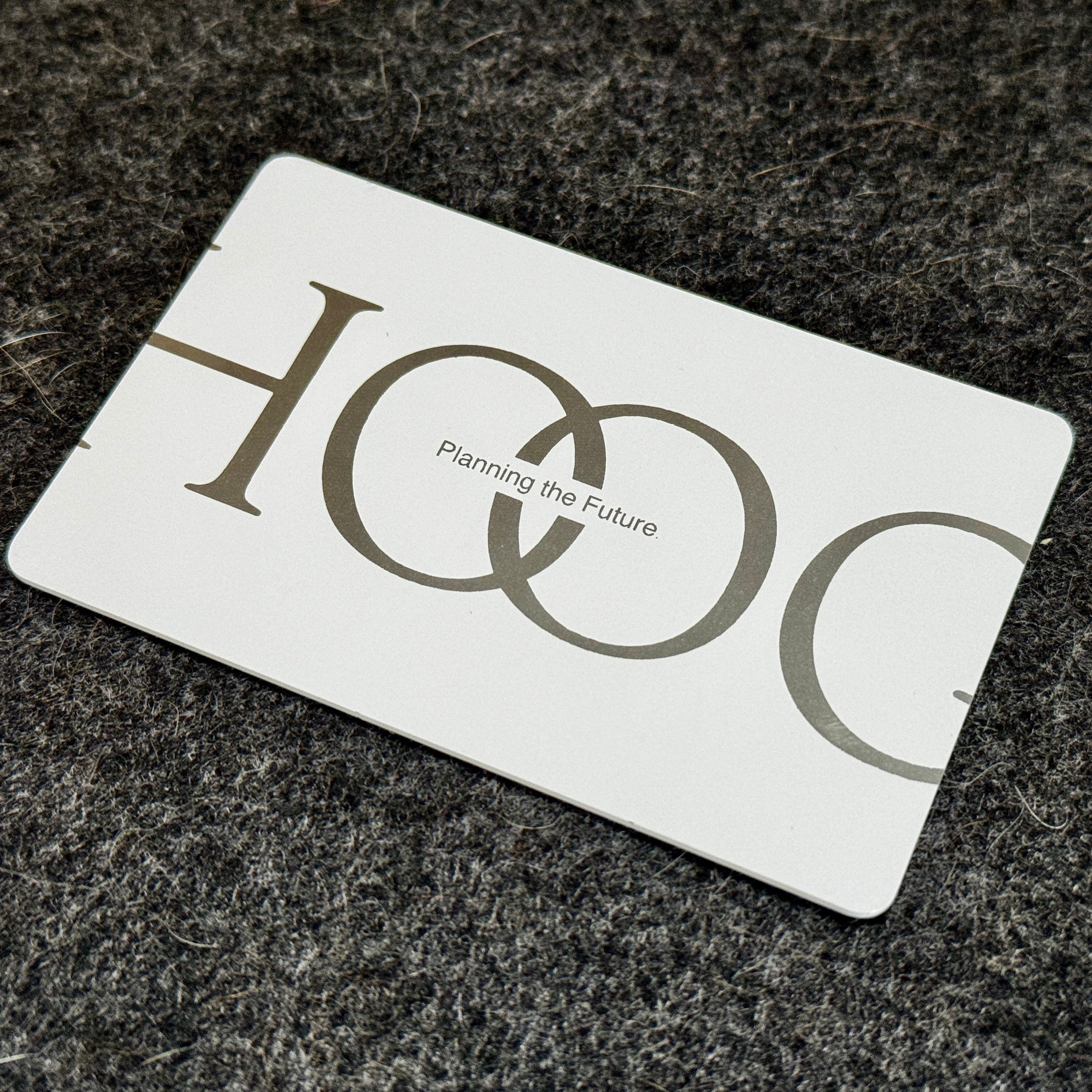 Custom White Tap Metal Business Card. Engraved silver on white. Tap to share contact information and digital profile