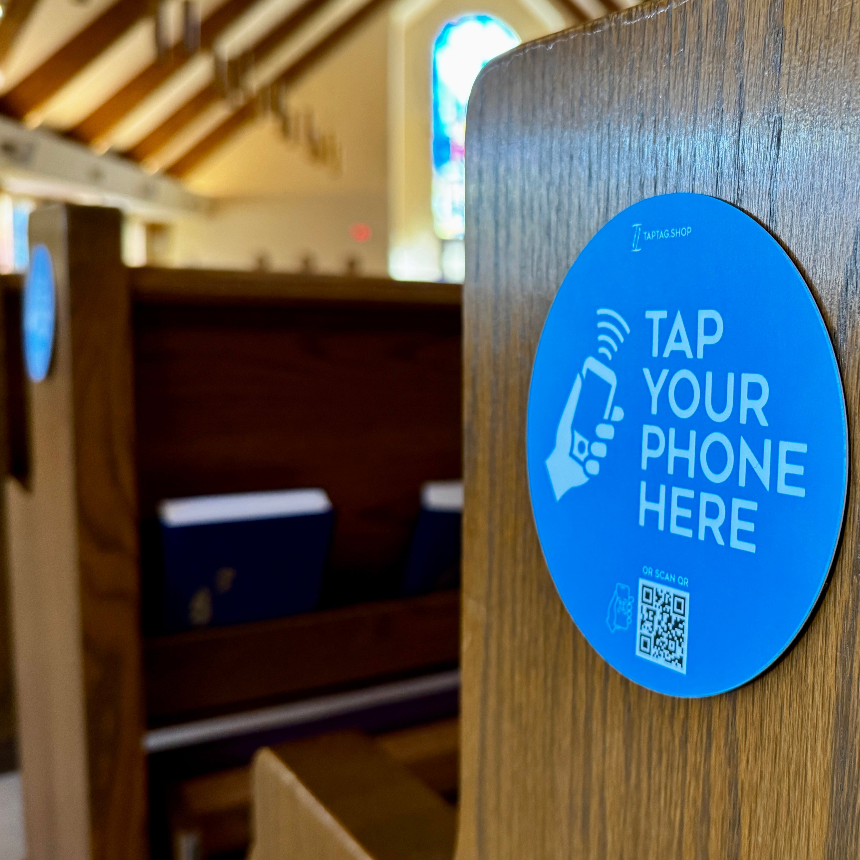 tap to scan qr sign on church pew